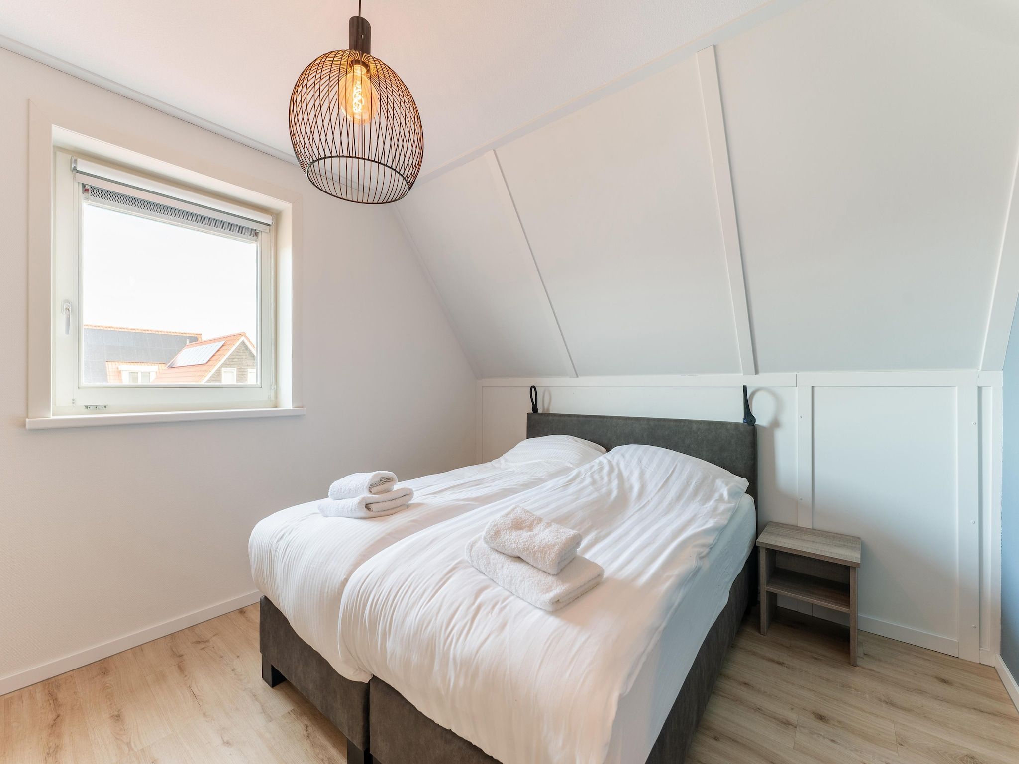 Een slaapkamer van De Pelikaan Huis Nr 45 in Scherpenisse