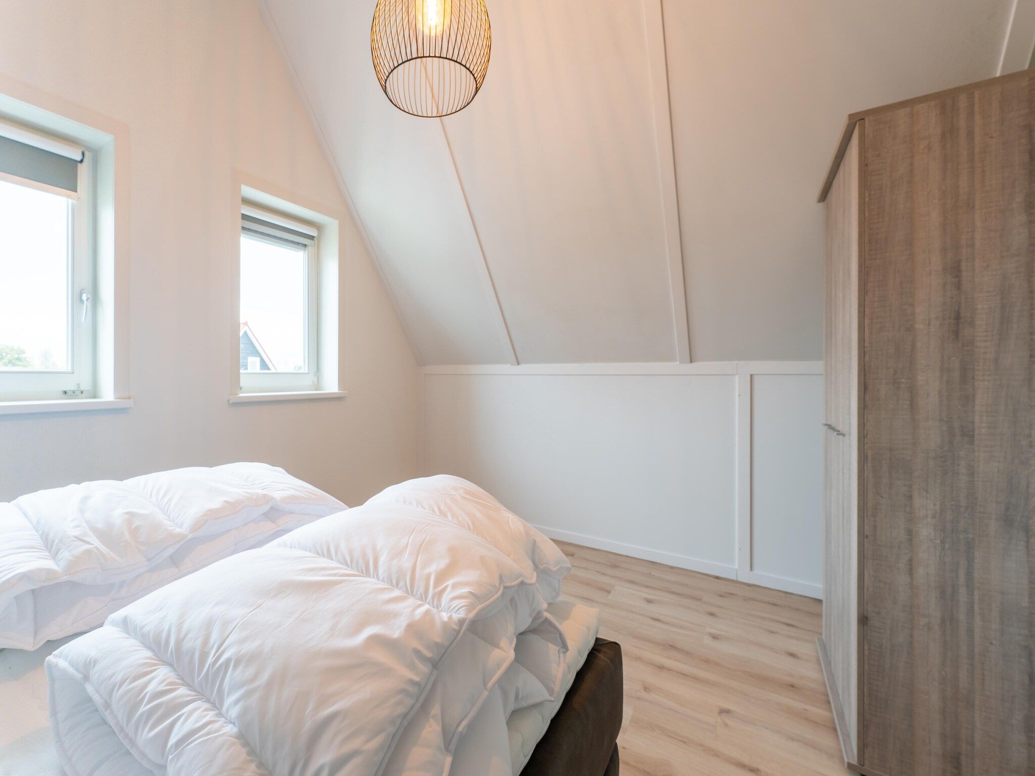 Een slaapkamer van De Albatros Huis Nr 49 in Scherpenisse