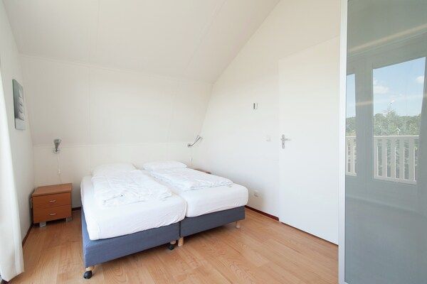 Slaapkamer - Vakantiehuis bij kust en bos in Noordwijk (5)