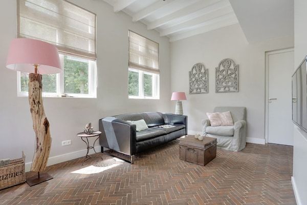 Woonkamer - Vakantiehuis met terras bij Bedafse Bergen in Uden (1)