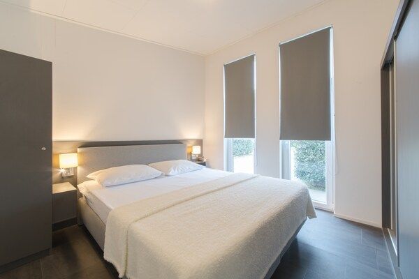 Slaapkamer - Modern chalet vlakbij het strand in Wemeldinge (3)