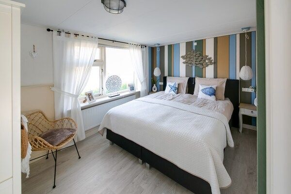 Slaapkamer - Vakantiehuis in een omgeving vlakbij de kust in Callantsoog (2)
