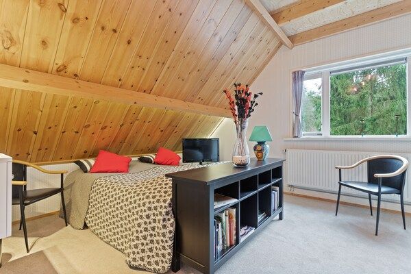 Slaapkamer - Terrasappartement met weelderige tuin in Epe (5)
