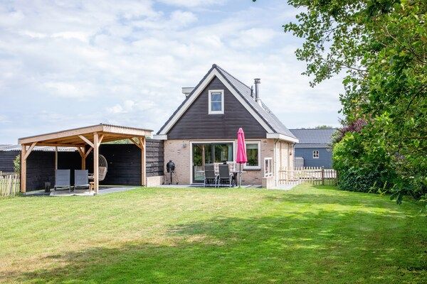 Buitenkant - Vakantiehuis bij duinen met wellness tuin in Den Burg (1)