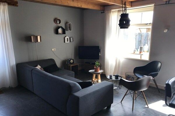 Woonkamer - Appartement met tuin in Nederlands landschap in Callantsoog (1)