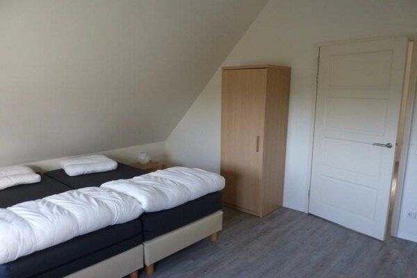 Slaapkamer - Luxe woning in Zeeland met infraroodsauna in Breskens (4)