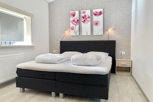 Slaapkamer - Vakantiehuis met omheinde tuin in Sint Maartenszee (5)