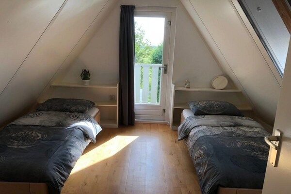 Slaapkamer - Mooi vakantiehuis in Burgerburg in Burgerbrug (4)