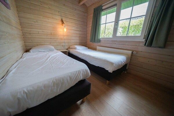 Slaapkamer - Ruim natuurverblijf voor 6 personen in Belfeld (3)