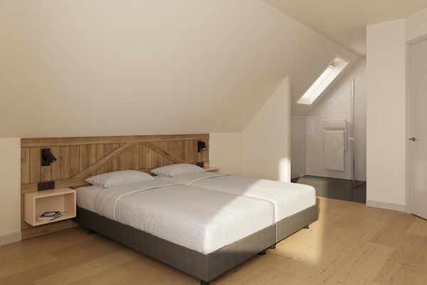 Slaapkamer - Ruim vakantiehuis met uitzicht op de kreek in TA Gasselte (4)