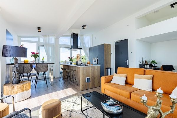 Woonkamer - Penthouse met uitzicht op het strand in Sint-Annaland (1)