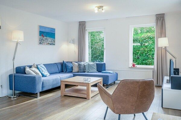 Woonkamer - Sfeervolle villa nabij zee en bos in De Koog (3)