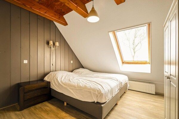 Slaapkamer - Appartement Boerderij bij het strand in Schagen (3)