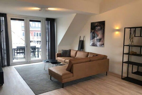 Woonkamer - 5-persoons lodge met privébalkon in Zoutelande (2)
