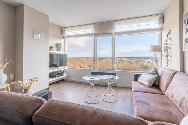 Woonkamer - 4 Persoons appartement met eilandzicht in De Koog (5)