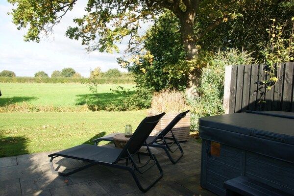 Tuin - Privésauna bij Wellness Lodge in Drenthe in Dalerveen (5)