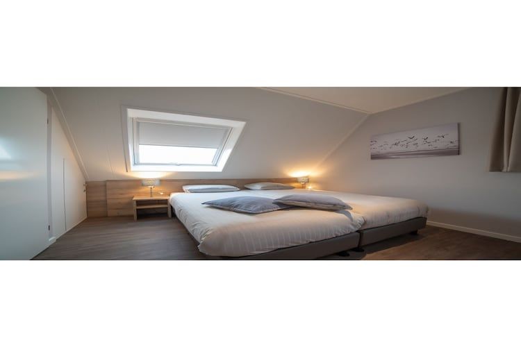 Een slaapkamer van 8 pers met jacuzzi in Colijnsplaat