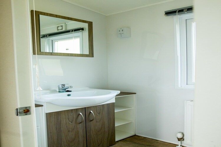 De badkamer van Recreatiepark Duinhoeve 11 in Udenhout