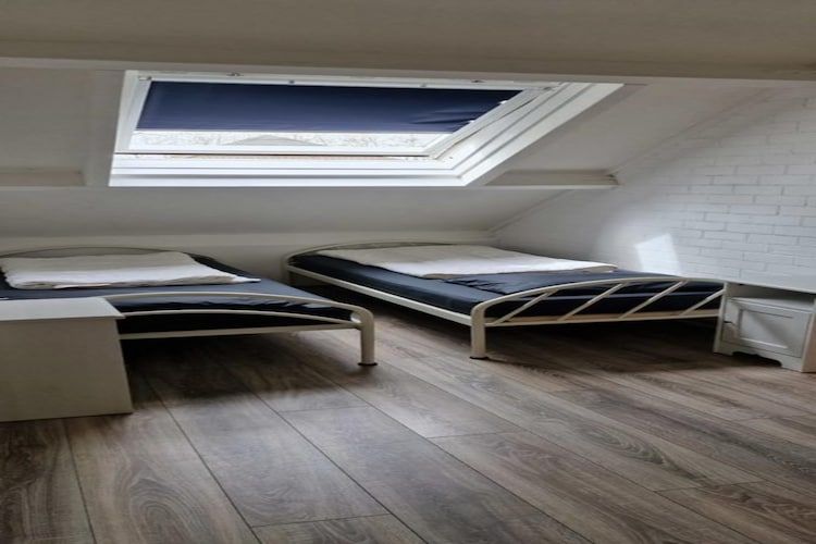 Een slaapkamer van Schoneveld 157 Duinroos Breskens in Breskens